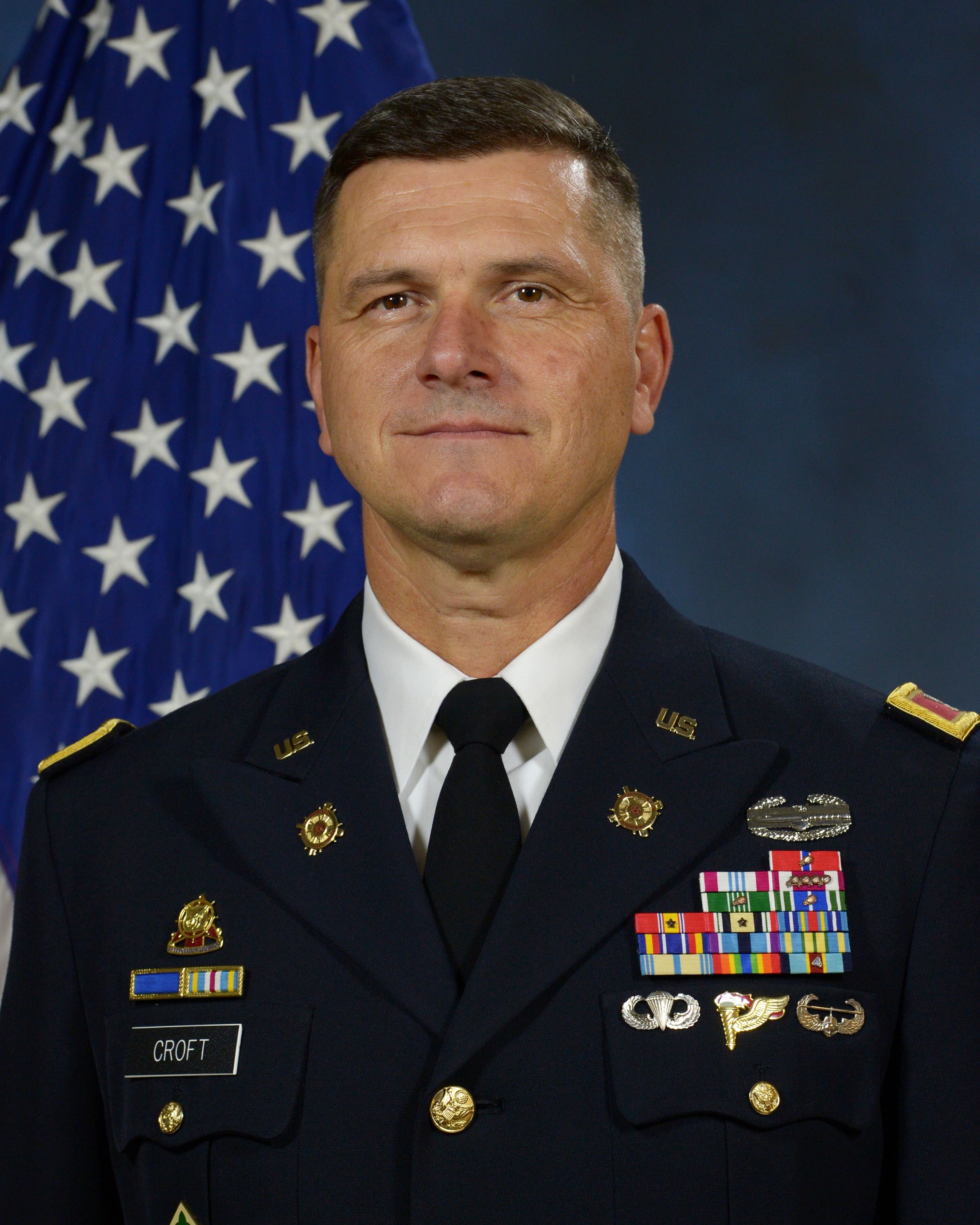 Col. Chris Croft in U.S. Army dress uniform with American flag